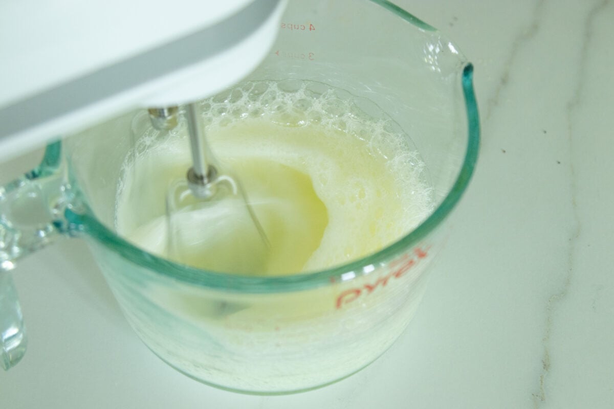 beating the egg white with the hand mixer