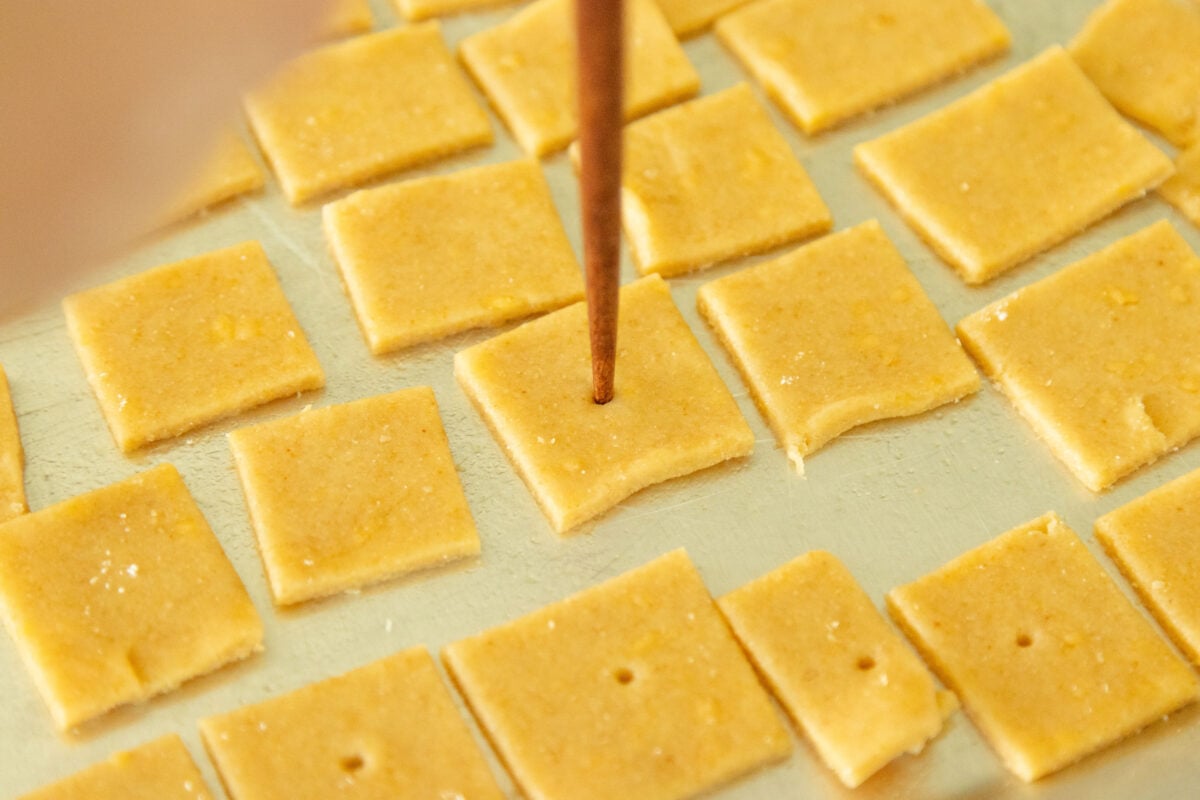 poking a hole in each cracker with a chopstick