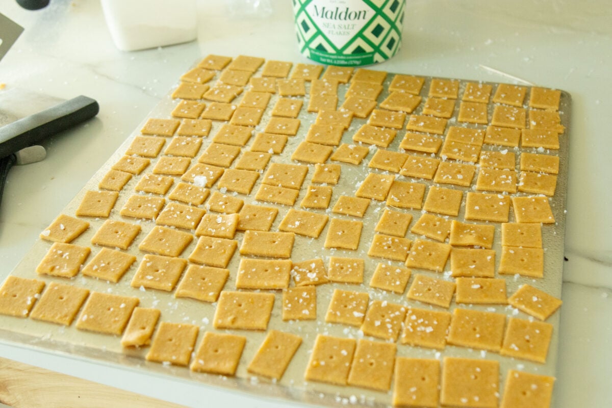 a pan of homemade cheddar cheese crackers ready for the oven