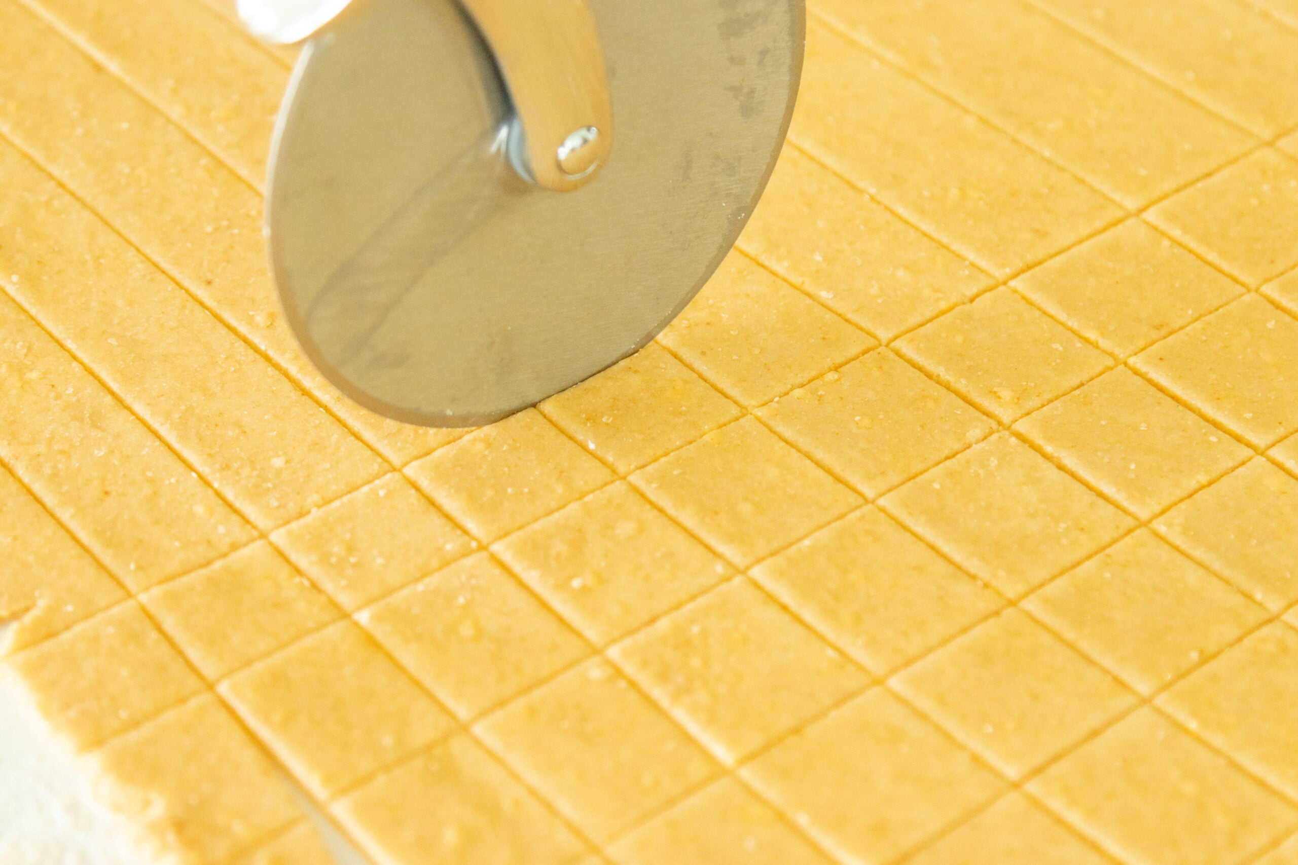 cutting the crackers with a pizza cutter