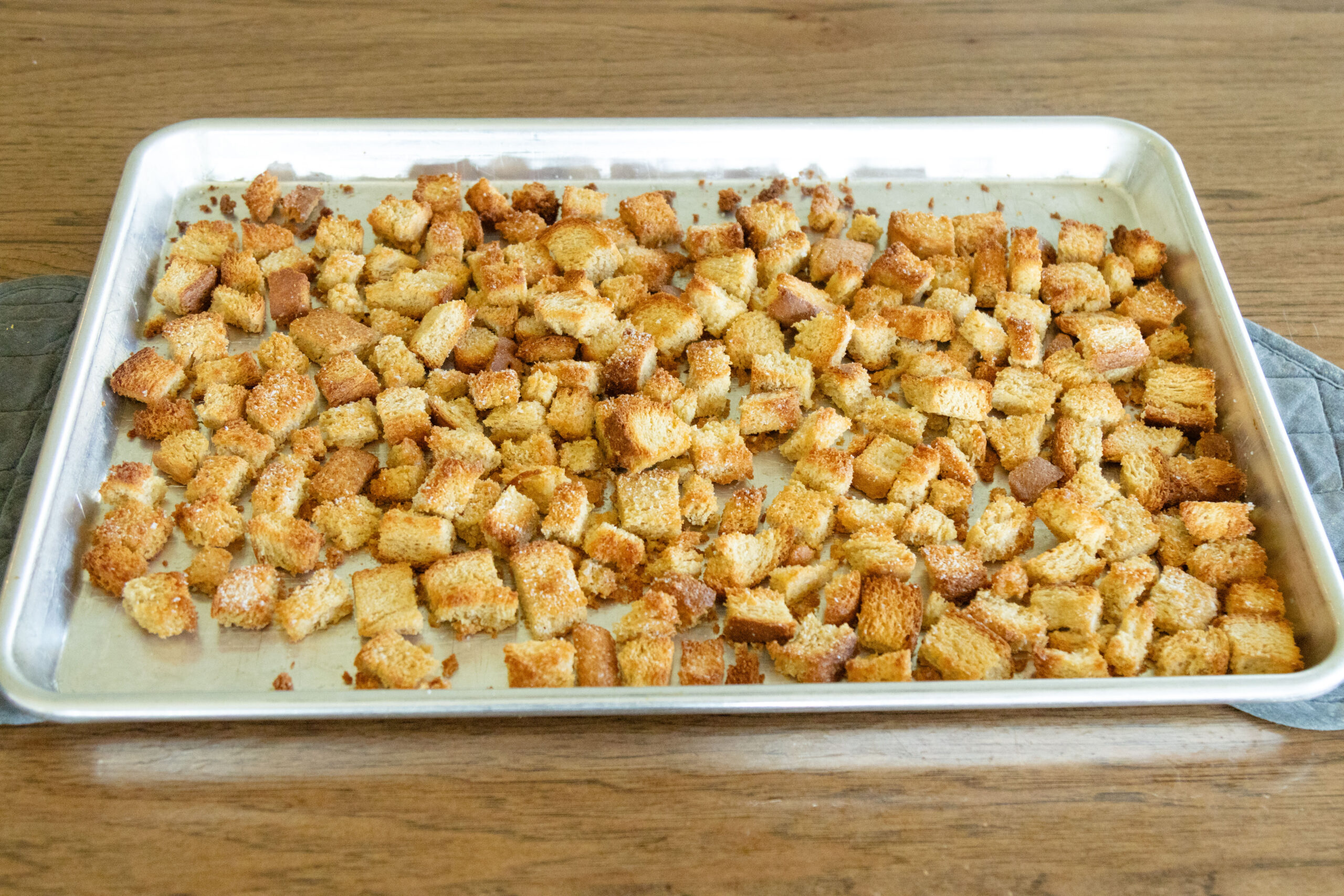 freshly baked croutons on a pan