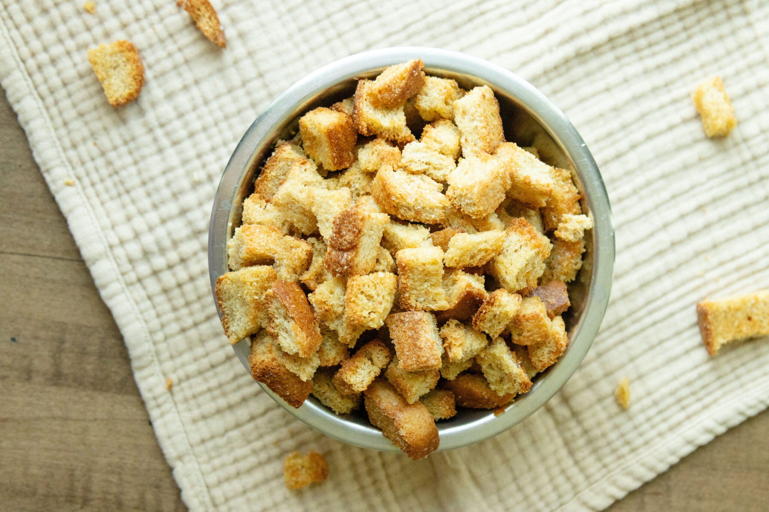 a bowl full of homemade whole wheat croutons