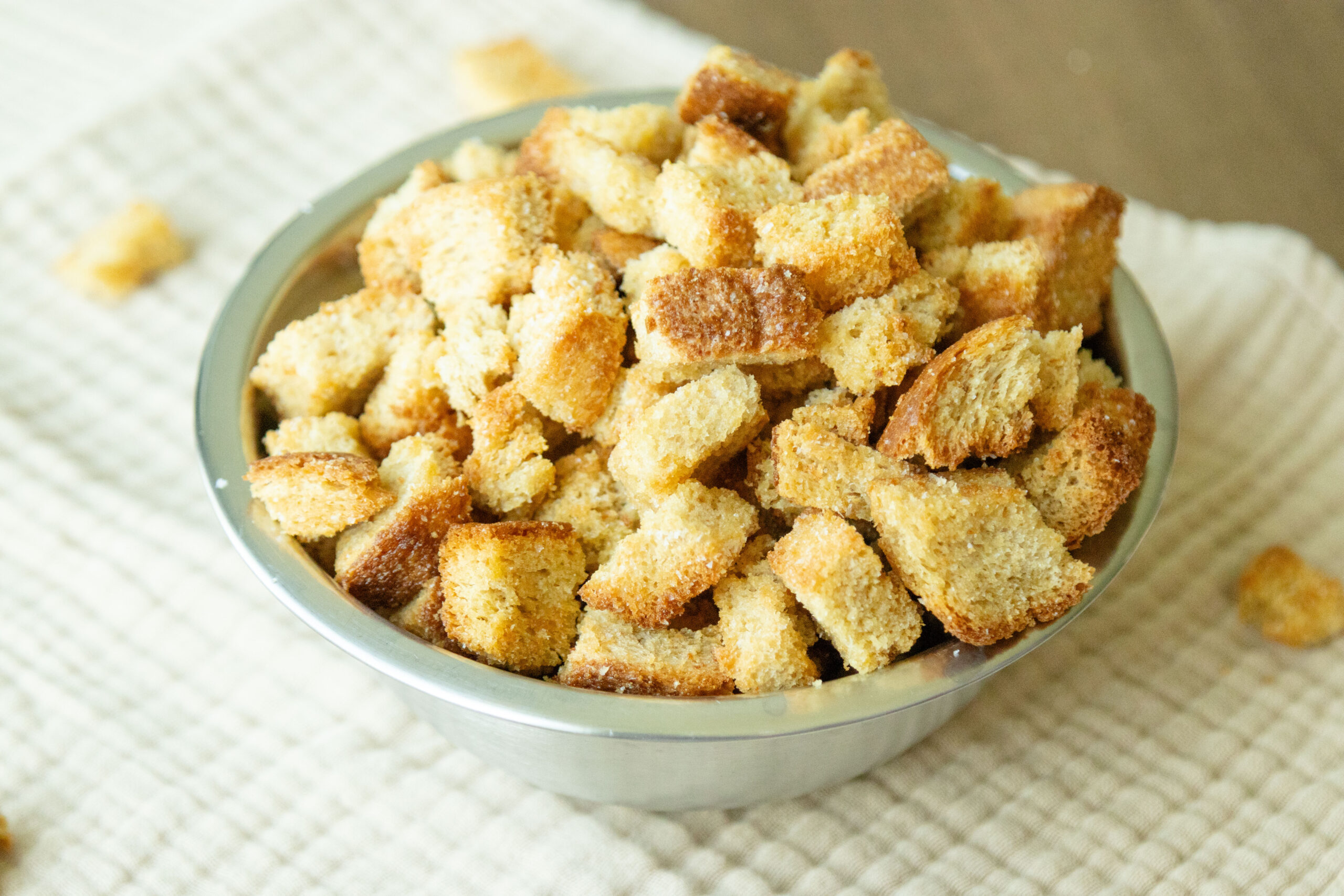 a bowl full of homemade whole wheat croutons