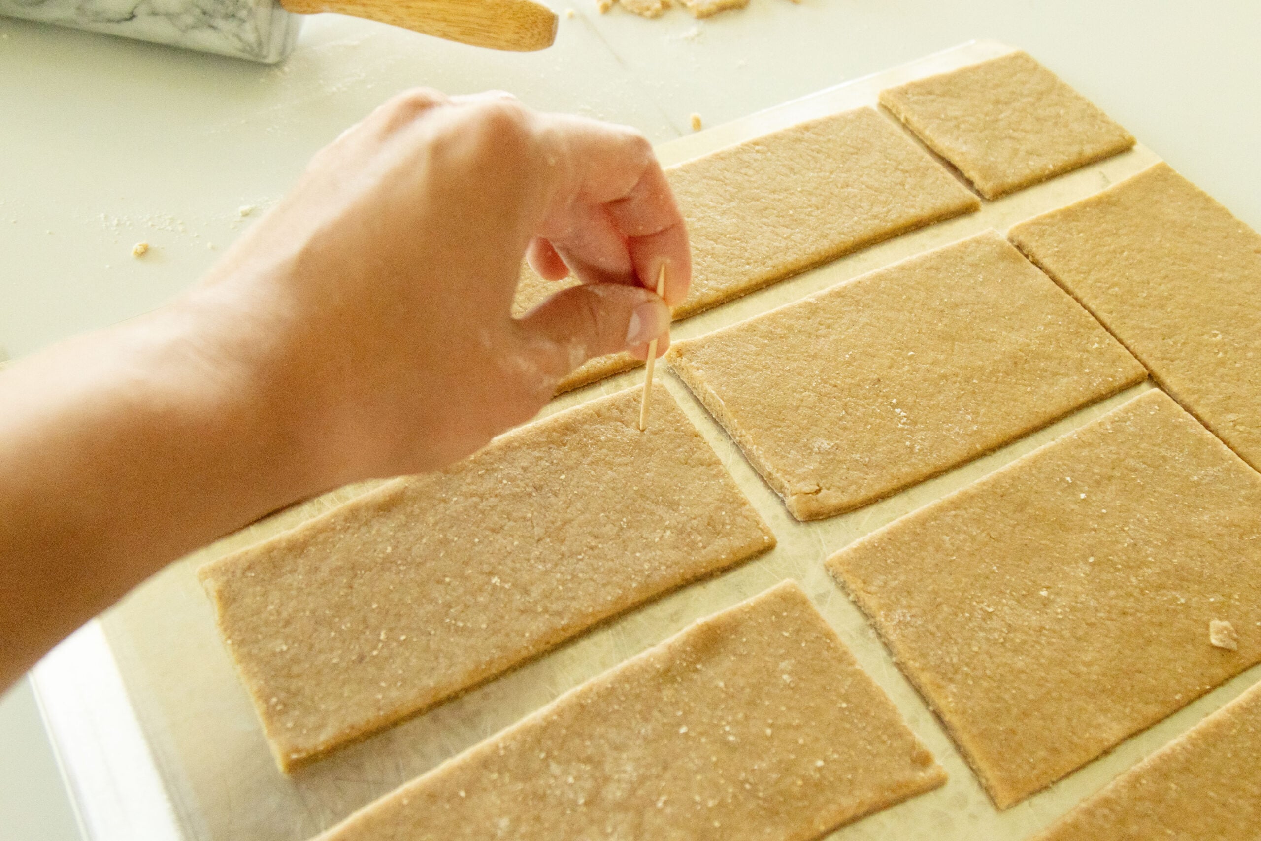 poking holes in the crackers