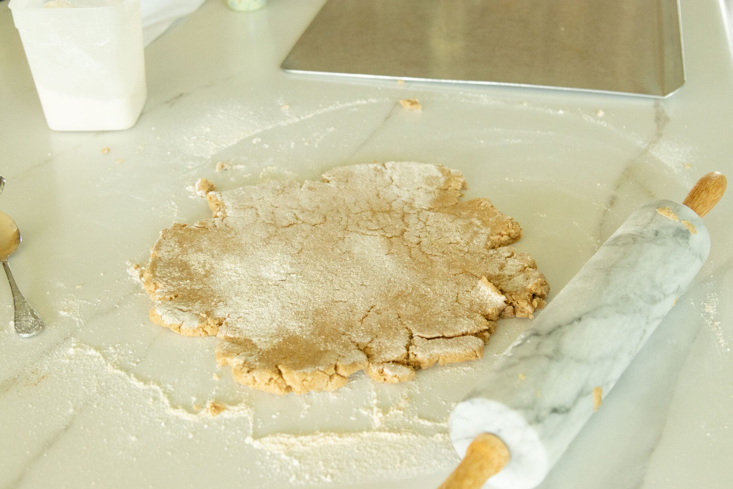 rolling out the dough on the counter top