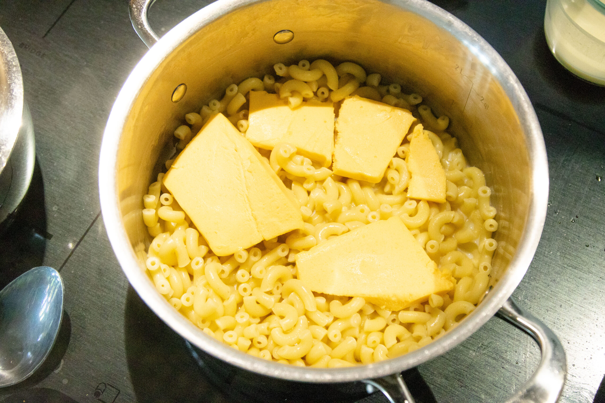 cheese melting on top of the cooked macaroni