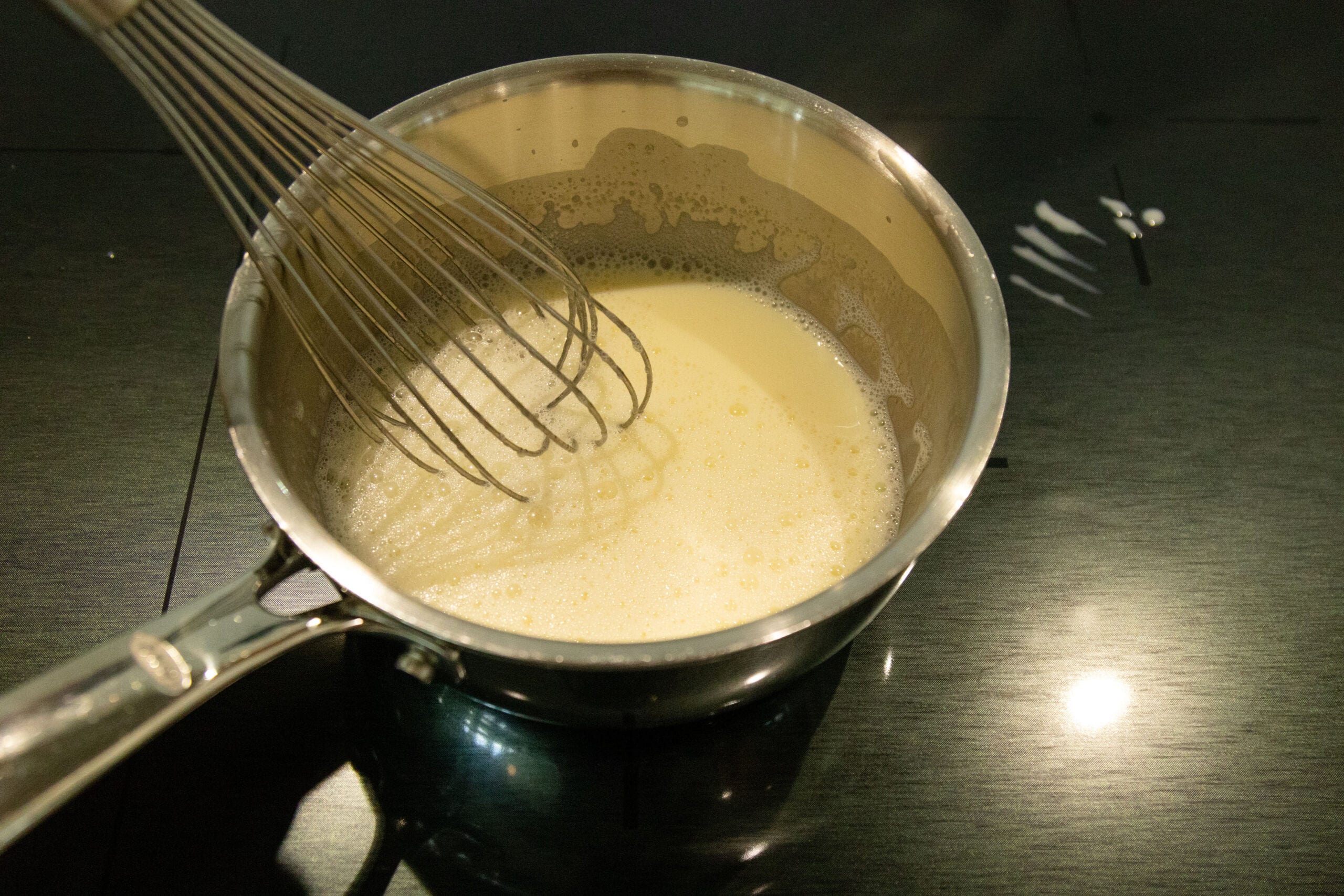 whisking the milk and gelatin in the saucepan