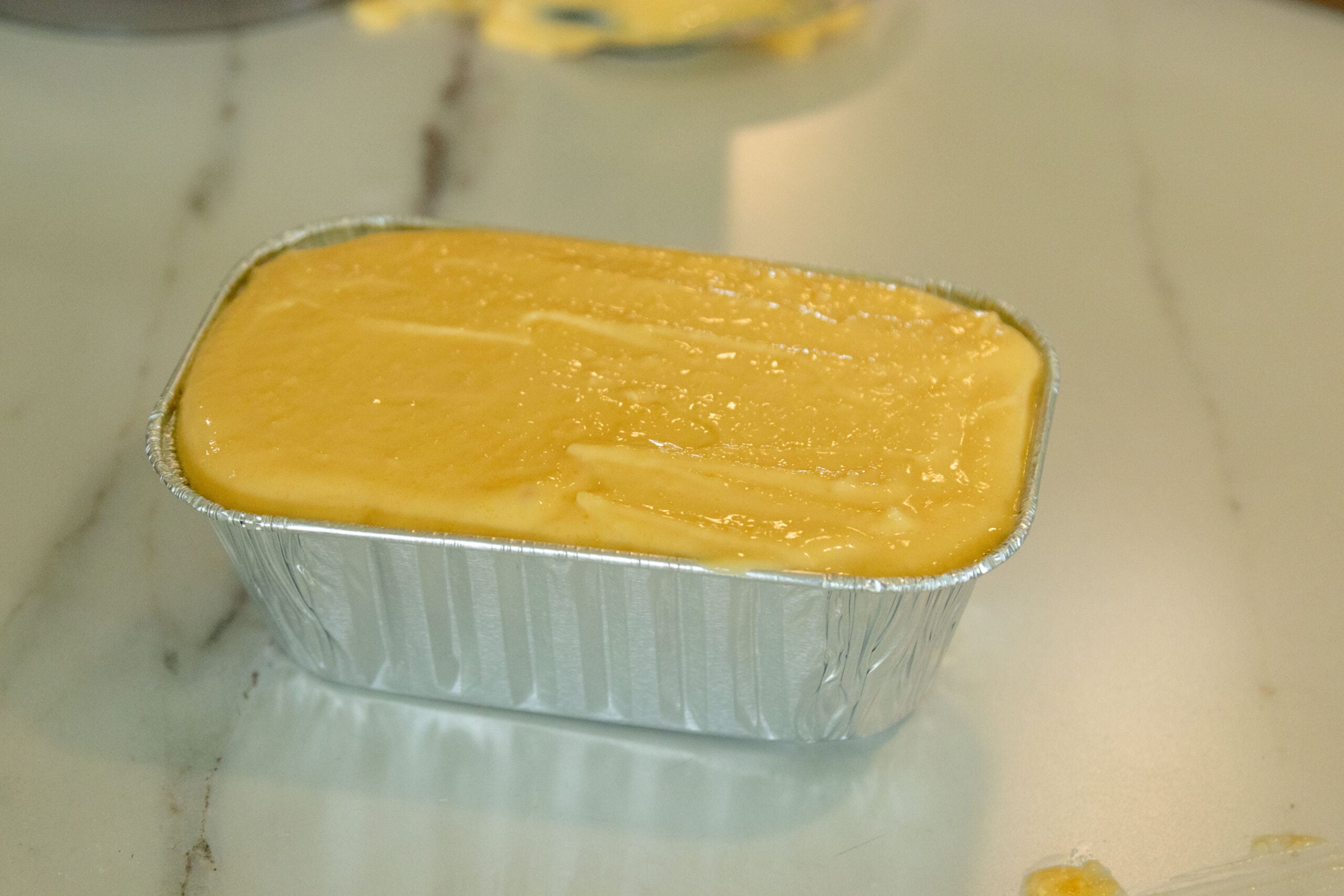 a pan of homemade velveeta cheese ready for the fridge