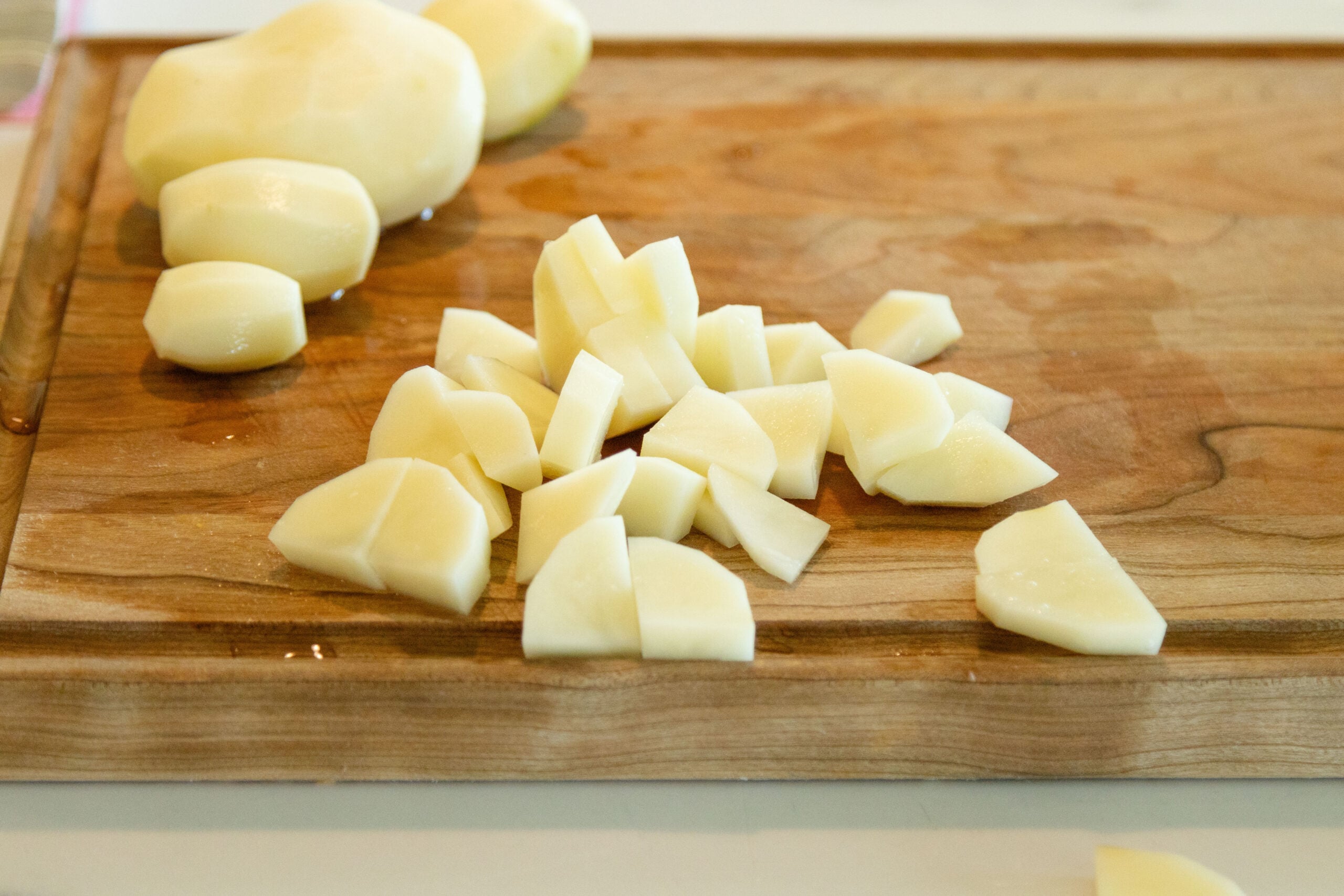 diced potatoes on a cutting board
