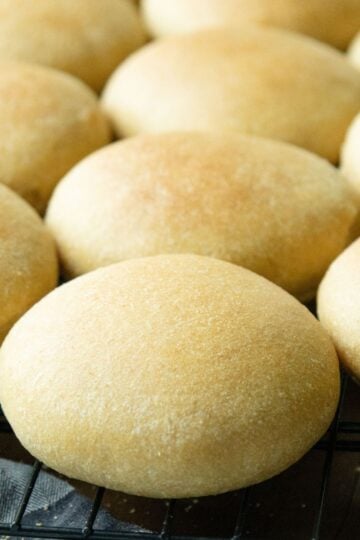 fresh milled hamburger buns cooling on a rack