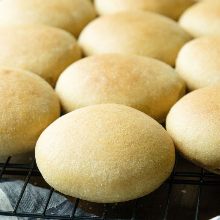 fresh milled hamburger buns cooling on a rack