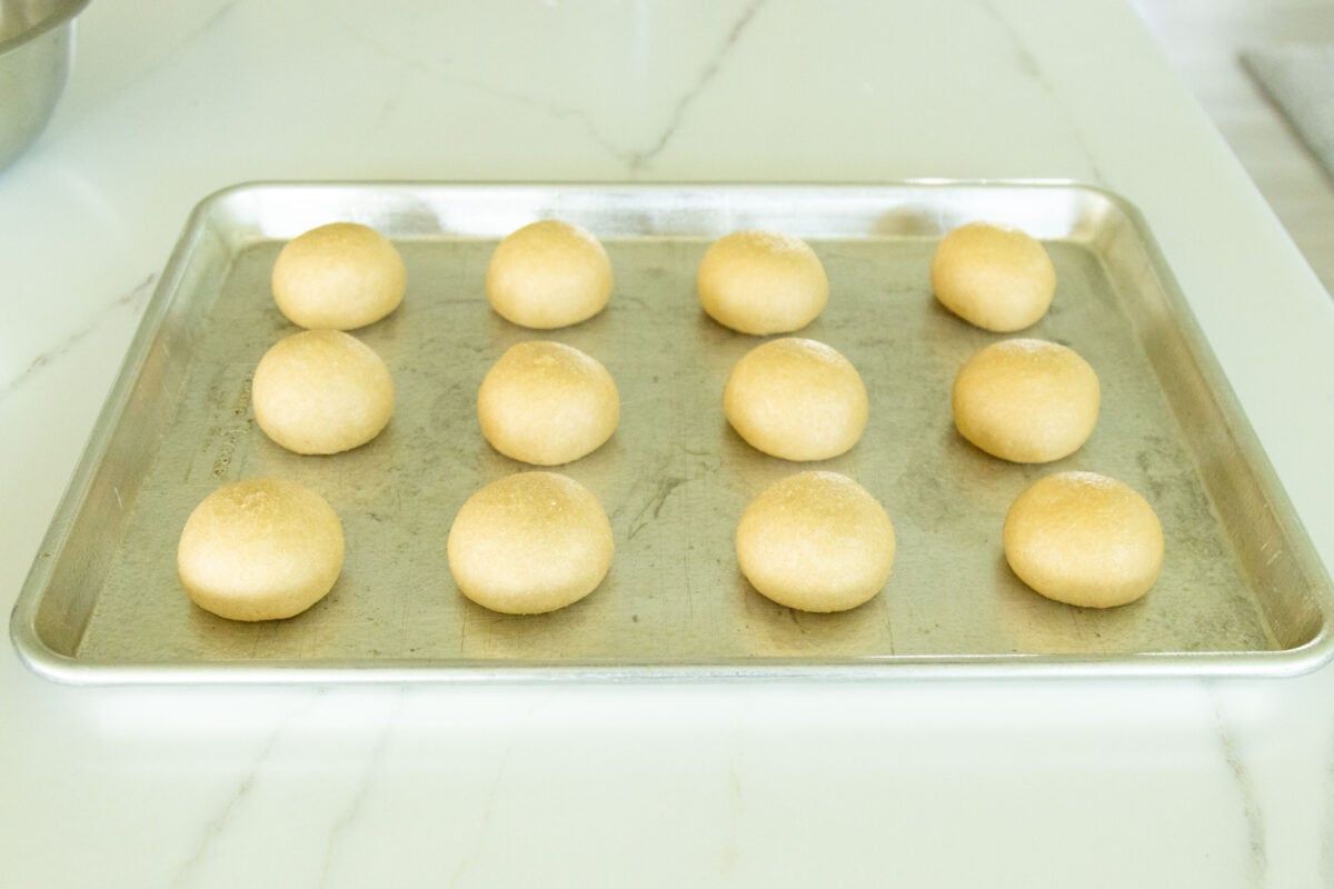 12 dough balls on a sheet pan