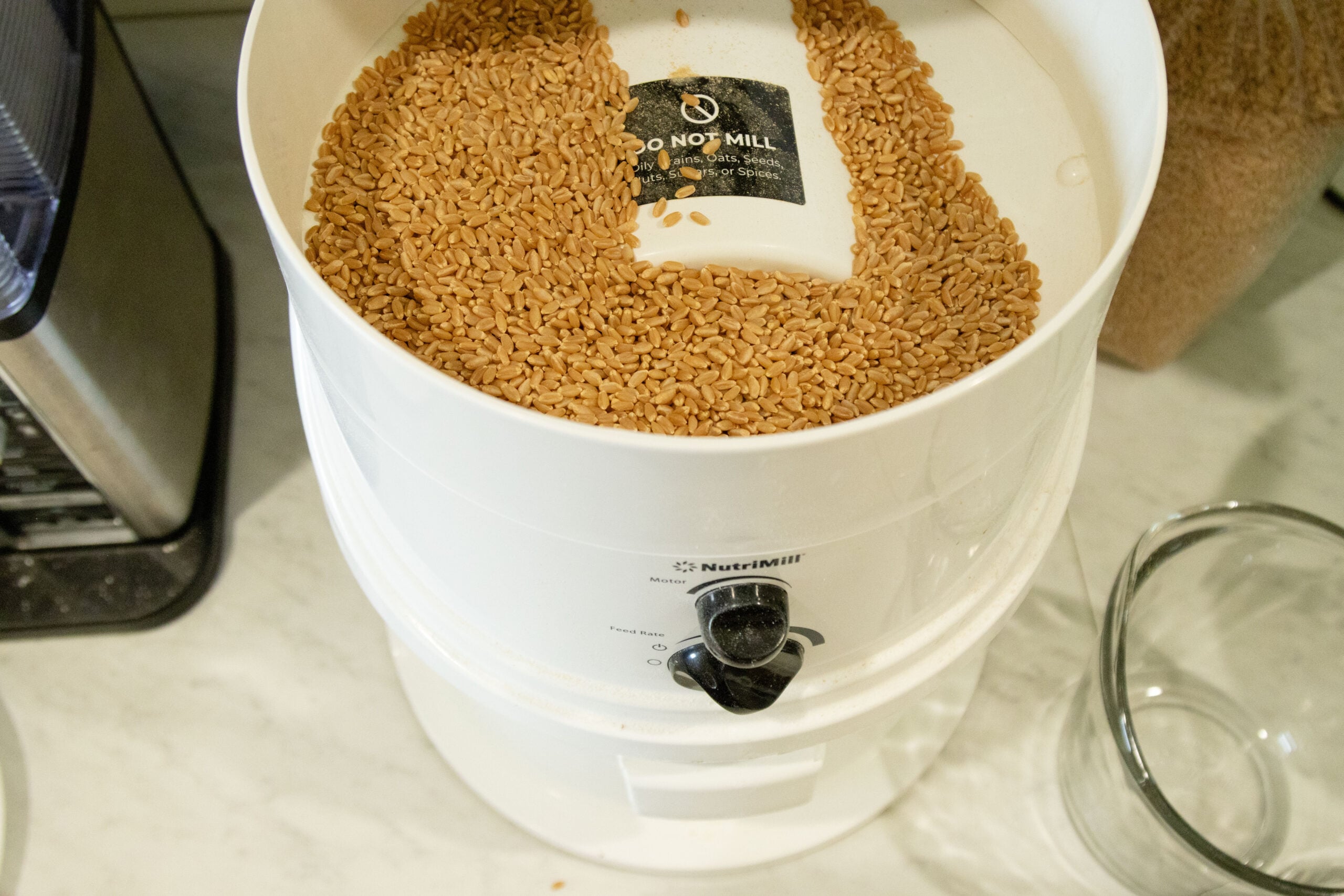 milling the wheat in the grain mill