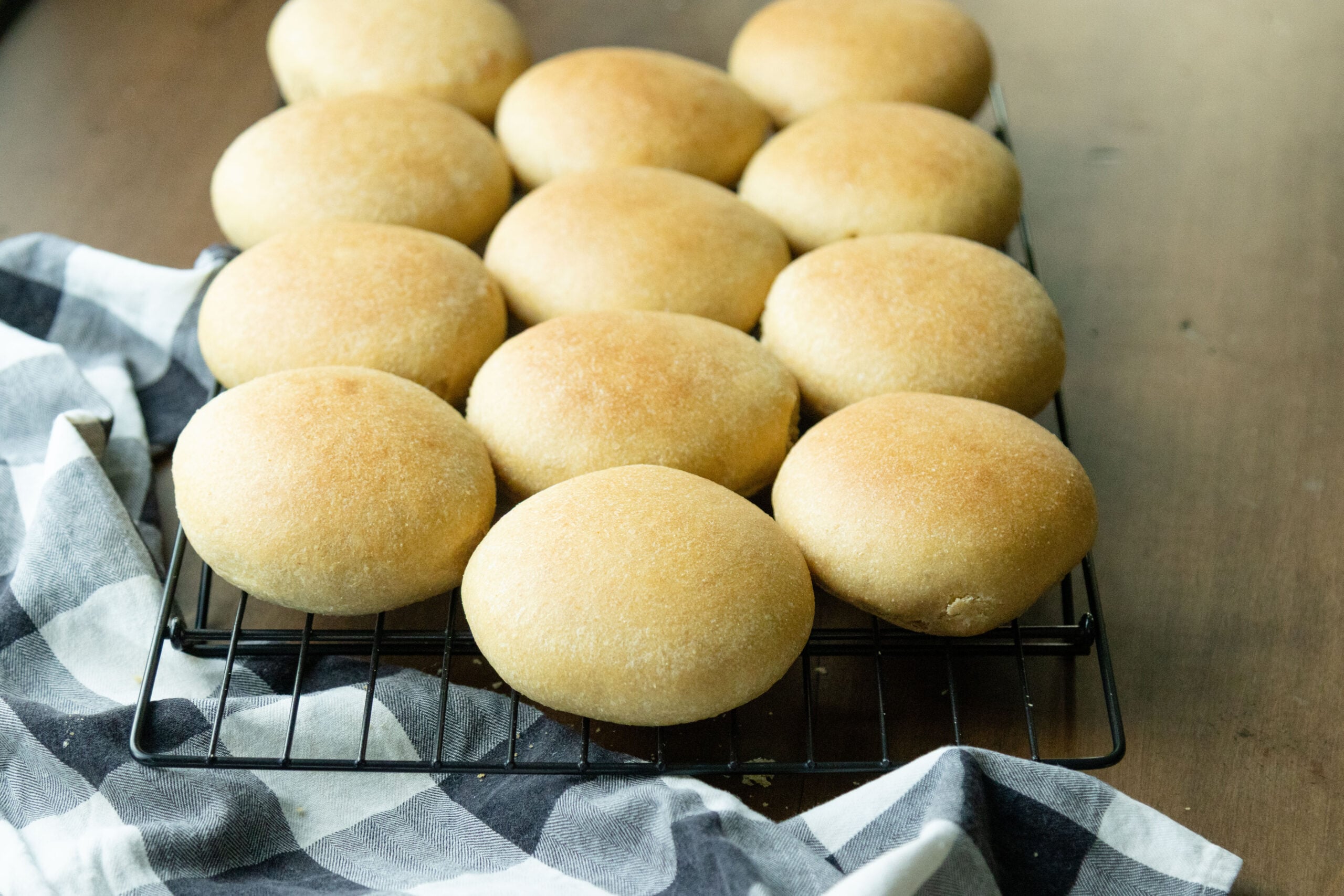 a rack full of fresh milled hamburger buns