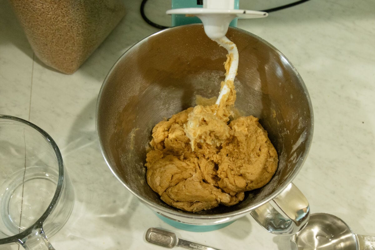 mixing together the ingredients in the mixer bowl