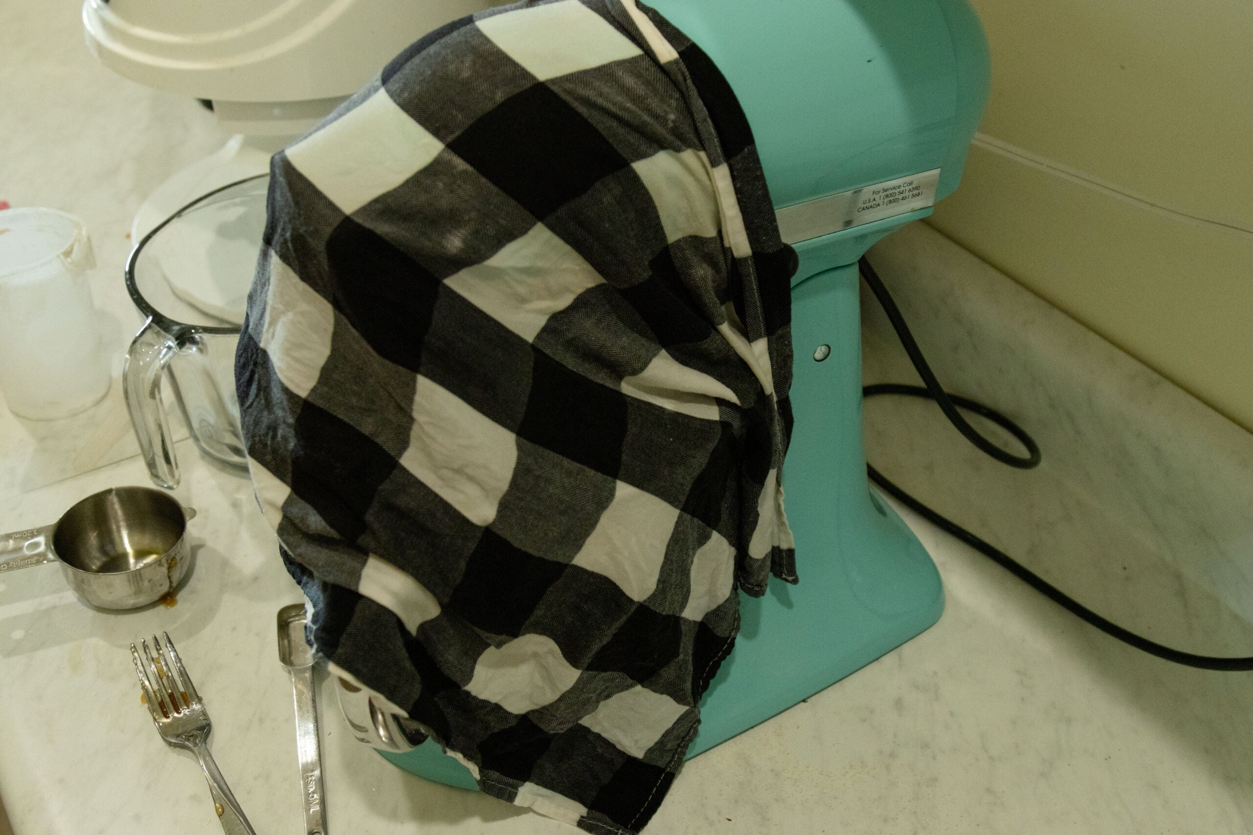 a cloth covering the bowl of dough
