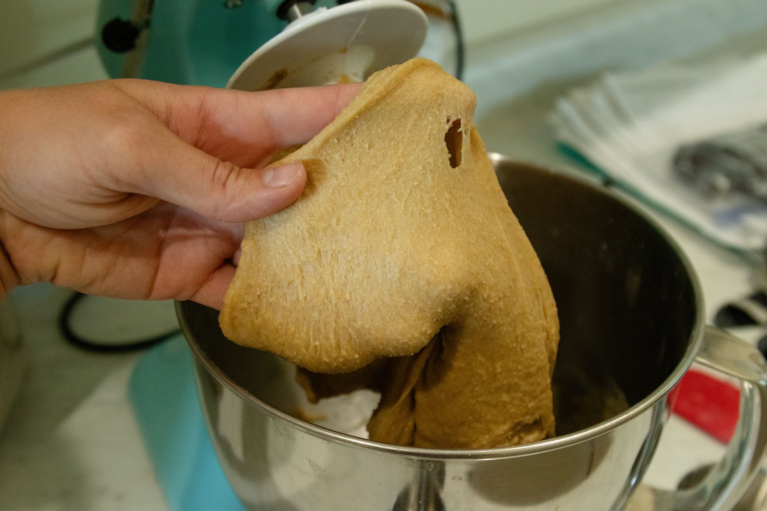 doing the windowpane test on the dough