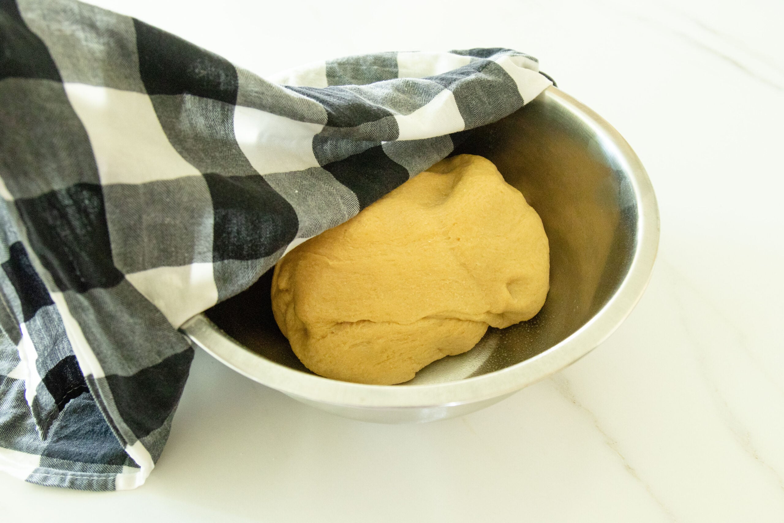 covering the dough to let it rise