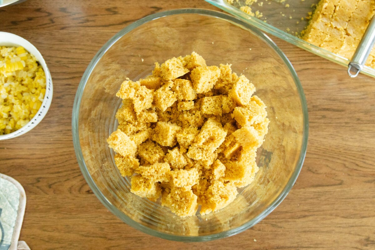 a layer of cornbread blocks in the salad bowl