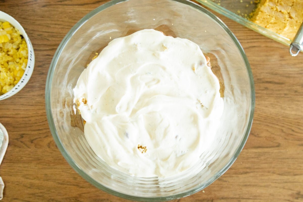 a layer of dressing in the salad bowl