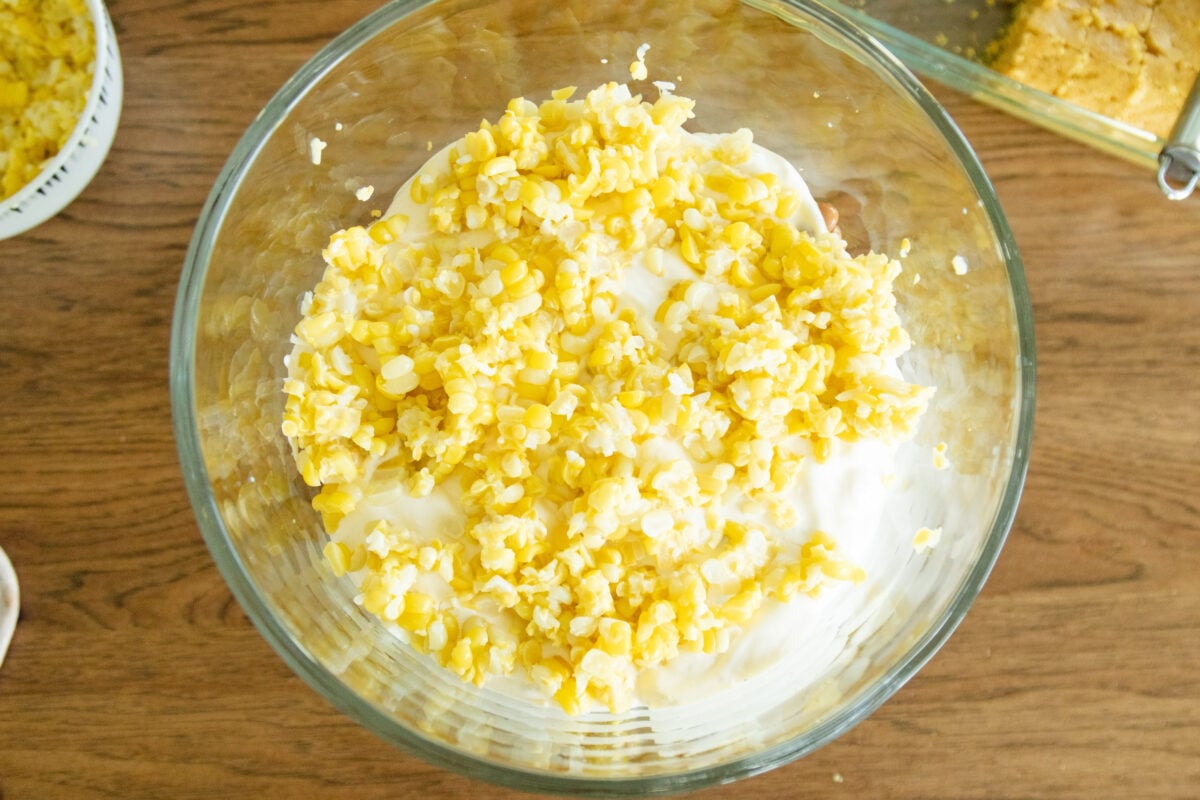 a layer of corn in the salad bowl