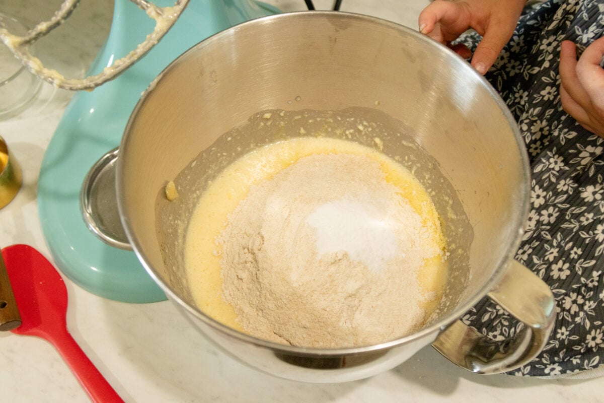 wet and dry ingredients for the cornbread in the mixing bowl