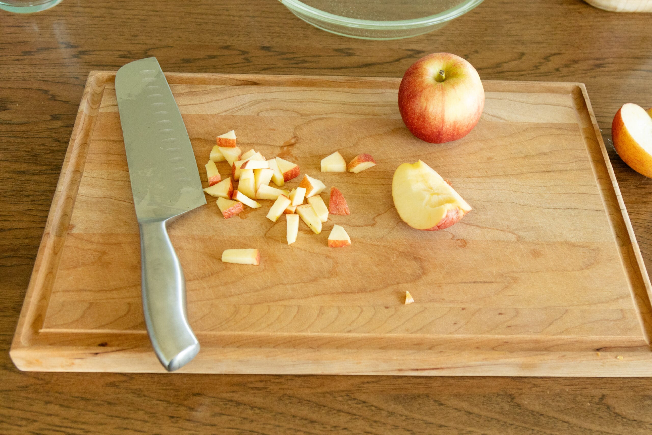 chopping an apple on the cutting board