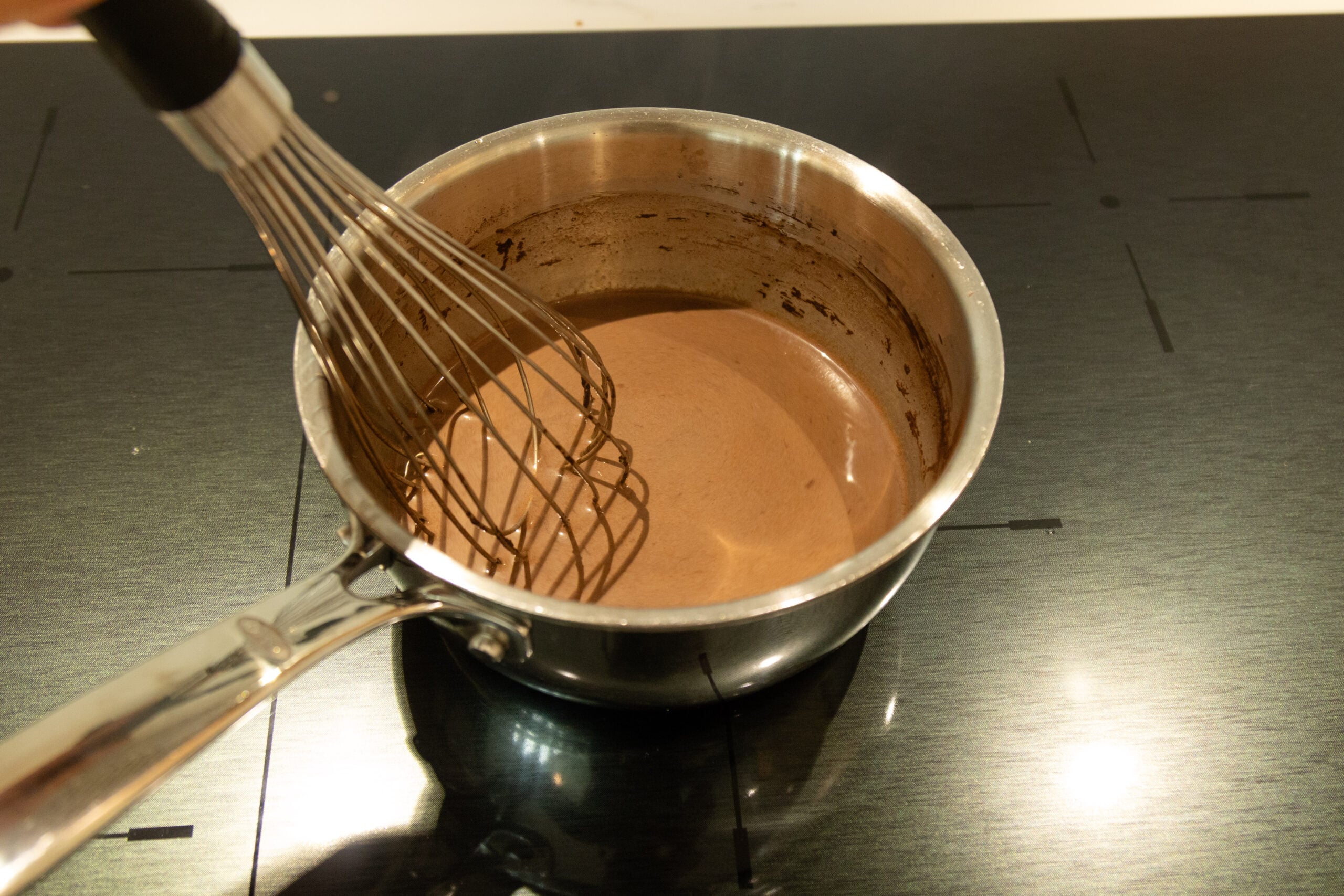 whisking the pumpkin spice hot cocoa