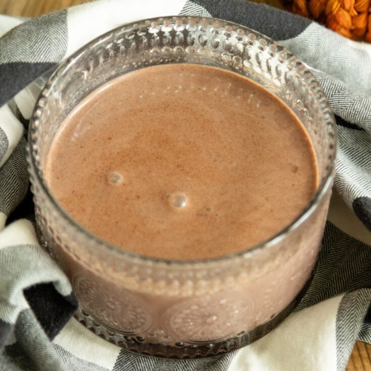a close-up look at a mug of pumpkin spice hot cocoa